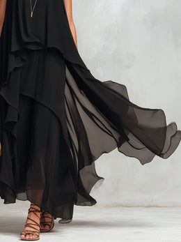 Abito maxi nero in chiffon a balze