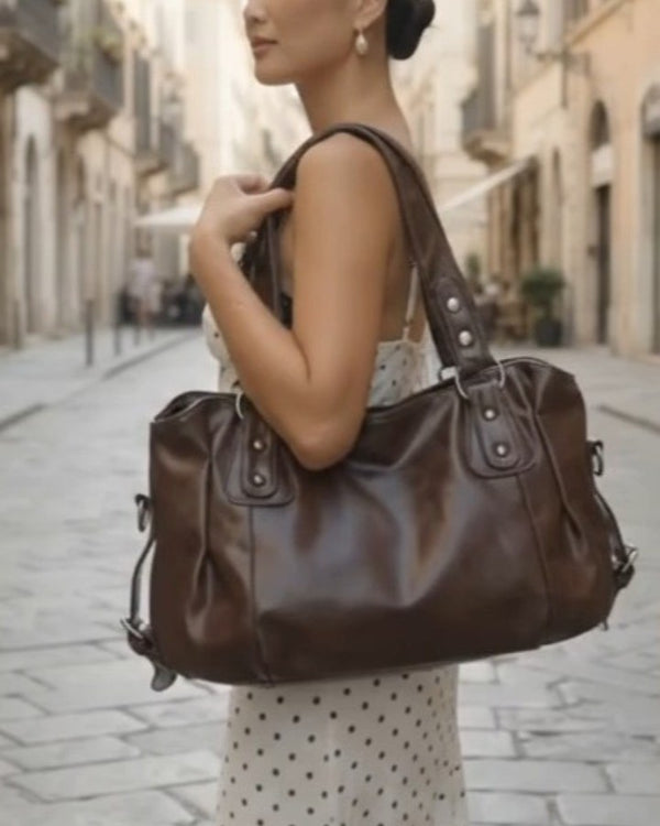 Borsa marrone e abito a pois — Instagram Maison Lalla